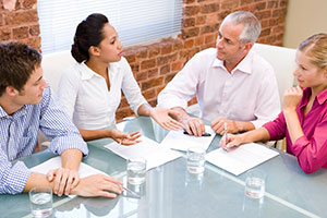 Coachable business people in meeting