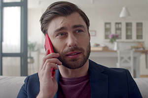 Photo of businessman sayng no on phone